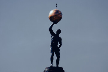A statue of Atlas holding the celestial spheres