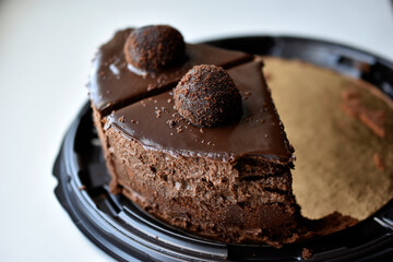 Yummy chocolate cake on a plate close-up