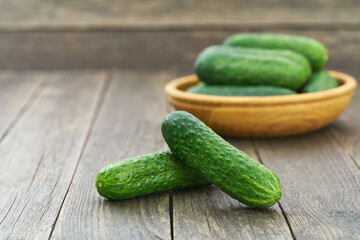 Fresh cucumber on the wooden table with copy space for text.
