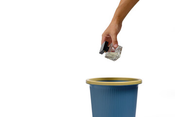 Bottle men perfume in hand is thrown into trash.On white background, an isolate.