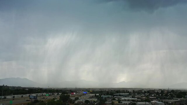 Lightning strikes the Orem Temple during construction from aerial view during summer storm in Utah.