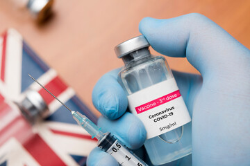 Doctor show a vial of 3rd dose of coronavirus covid-19 vaccine