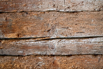 Very old wooden wall eaten by woodworm as background or texture
