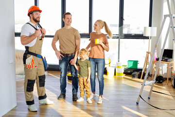 Young caucasian family with child admire the renovations in new home talking with pleasant...