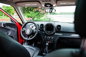 Fototapeta premium Interior of red city car. Small car for cities.
