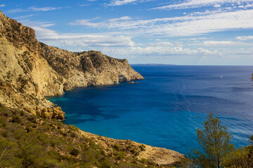 Obraz premium landscape ibiza with motorboat in the sea on a sunny day