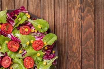  Vegetarian diet. Vegetable mix: Lettuce, red radicchio, cherry tomatoes, corn