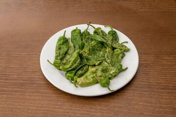 Fried green peppers with salt typical of northern Spain. Padrón peppers, some hot and others not.