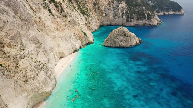 Drone view at scenic coastline of Porto Katsiki at Lefkada island, tall cliff and beautiful turquoise sea water. Greek travel destination for summer vacation.