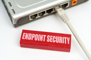 There is a router connected to the network on the table, next to a plaque with the inscription - Endpoint Security