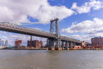 A picture of Williamsburg Bridge in New York City, USA. In the picture one can see the East River,...