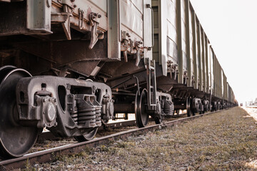 Fototapeta na wymiar Freight train carriages. Close up of railway wheels. Railway transport system.