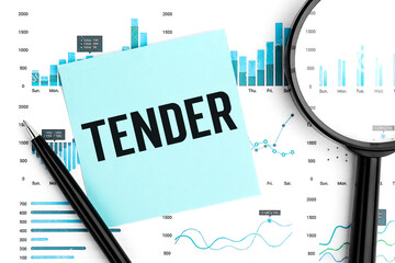 Word TENDER on sticker, magnifier, chart, diagram. Close up.