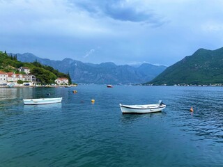 Fototapeta na wymiar Travel Journey - Perast, Montenegro. Boats on the coast