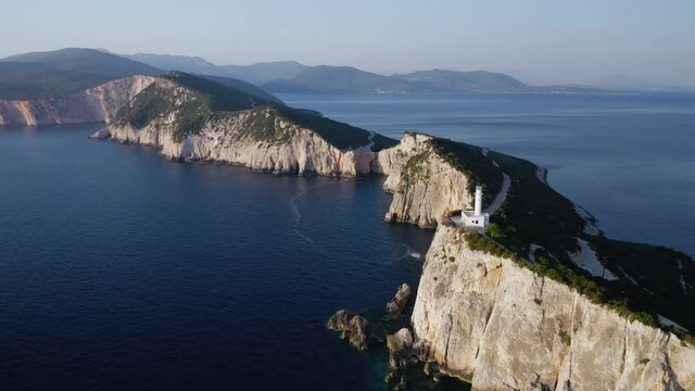Aerial view of Cape of Ducato, famous lighthouse of Greek island Lefkada, tracking shot, 4K.