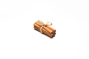 sticks of dry cinnamon tied with a twine (rope) on a white background, isolate for designers