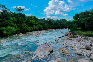 Beautiful and natural cristal blue river running through the Andes of Ecuador named Piatua