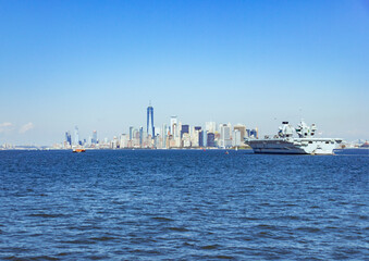 Fototapeta na wymiar A picture of Manhattan skyline from Staten Island, NY, USA with an aircraft carrier