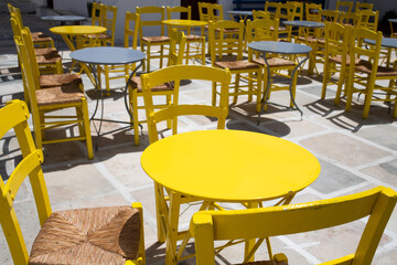 yellow table on sunny restaurant terrace
