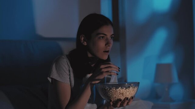 horror movie night television scared woman popcorn