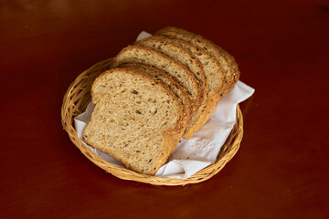 Sliced gluten-free vegan bread in a wooden basket. Healthy eating concept.