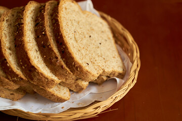 Sliced gluten-free vegan bread in a wooden basket. Healthy eating concept.