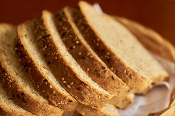 Sliced gluten-free vegan bread in a wooden basket. Healthy eating concept.