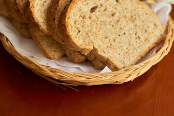 Sliced gluten-free vegan bread in a wooden basket. Healthy eating concept.