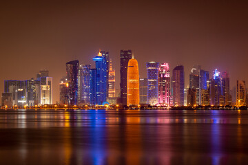 Fototapeta premium Illuminated skyline of Doha at night, Qatar, Middle East.