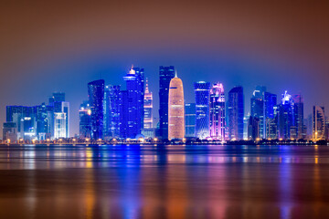 Obraz premium Illuminated skyline of Doha at night, Qatar, Middle East.