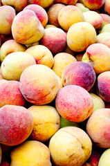 rich in flavor and delicious peaches in a popular market at sunrise in south america