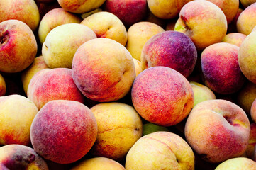 rich in flavor and delicious peaches in a popular market at sunrise in south america