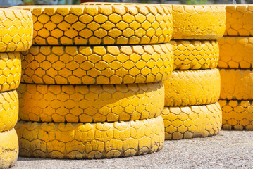 Tires painted yellow for on-track fence.