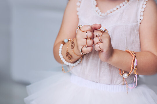 bijou jewelry rings on little baby girl hands