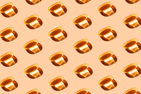Creative pattern made of yellow omega 3 capsule. Vitamins and supplements concept. minimal style. Top view. Flat lay.