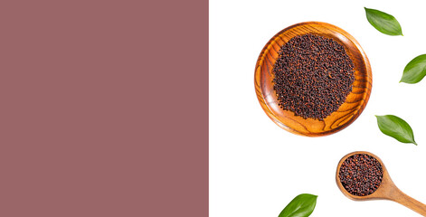 Brown mustard grains in the wooden bowl