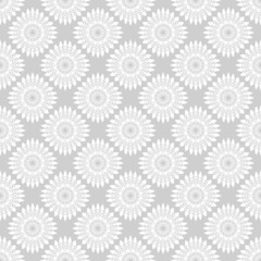 Winter seamless pattern with white snowflakes on grey background. Vector illustration for fabric, textile wallpaper, posters, gift wrapping paper. Christmas vector illustration. Falling snow