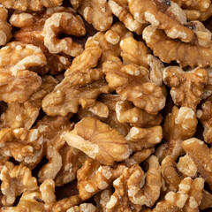 Closeup top view of walnuts. Food backdrop