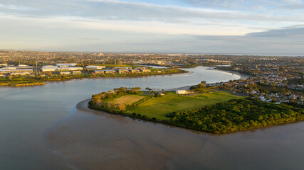 Obraz premium Aerial View from the Ocean, Forest, Green Trees, City Streets Football Soccer Field Seaside Park in Otahuhu, New Zealand - Auckland