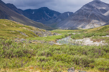 Fototapeta na wymiar A stream flowing in the summer time in Gates of the Arctic National Park (Alaska), the least visited national park in the United States.
