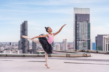 Fototapeta na wymiar ballerina dancer performing ballet dance on rooftop