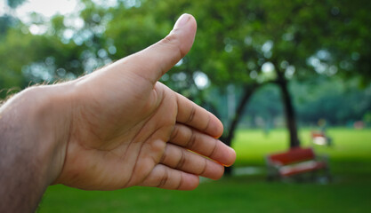 a man giving hand to hand shake