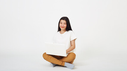 woman attractive sitting on the floor using laptop