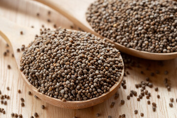 Close-up Perilla seeds in a wooden spoon are grains that can be eaten with both seeds and leaves. It can be found in the northern part of Thailand.
