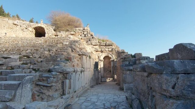 Dolly in through the stage side walkway of Odeon small theatre in Ephesus.