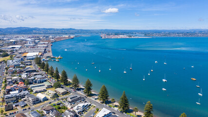 Aerial View from Houses close to the Beach, Green Trees, Mountain, Mount Maunganui, Boats in...