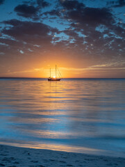 Beautiful Seaside Sunset with Boat in Portrait Orientation