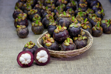 lot of mangosteen fruit on burlap