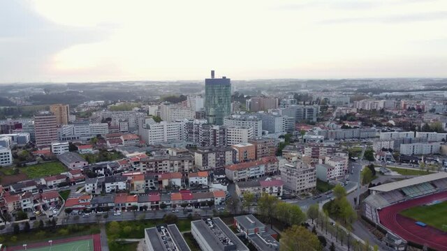 Epic aerial view of the magnificent Maia city, Portugal at evening.Establishing shot of neighborhood,stadium,football,large building suburb,Real estate, drone shots, sunset, sunlight, from above.