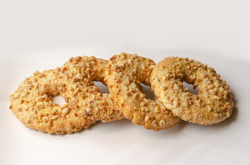 Close-up of four homemade Peanut Cookie Rings on a light backgro